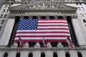 An American flag is displayed on the New York Stock Exchange in New York, Monday, February 24, 2025…