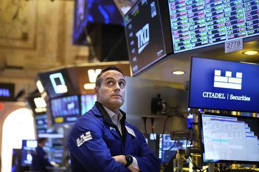 A news conference by Federal Reserve Chair Jerome Powell is displayed on the floor of the New York …