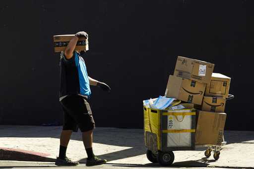 An Amazon worker delivers packages in Los Angeles on October 1, 2020