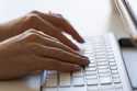 A person types on a keyboard on June 6, 2024, in Portland, Ore. (AP Photo/Jenny Kane, File)