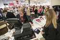 Terri Ross, left, checks out a customer at a store in the Huntington Mall in Barboursville, W