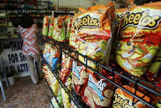 Flamin' Hot Cheetos are pictured near the front door of La Azteca Market in South Los Angeles, Augu…