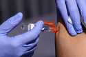A patient is given a flu vaccine October 28, 2022, in Lynwood, Calif