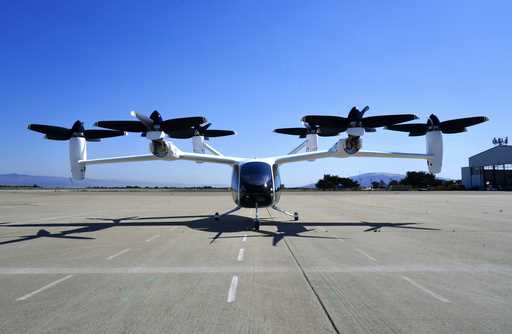 An "electric vertical take-off and landing" aircraft built by Joby Aviation is parked at an airfiel…