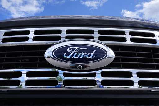 The Ford logo is shown on the grill of a pick-up truck on a dealership lot, on May 29, 2024, in Sal…