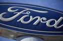 The Ford company logo is seen, October 24, 2021, on a sign at a Ford dealership in southeast Denver…