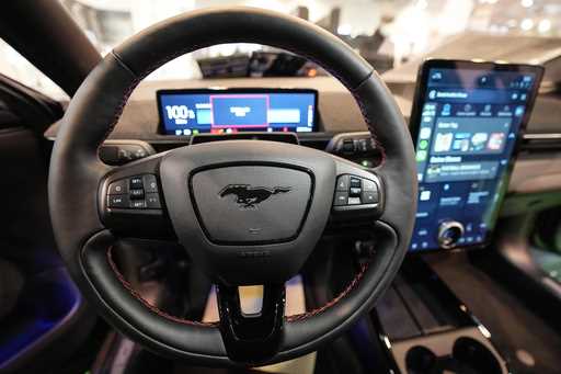 The cockpit of a Ford Mustang Mach-E electric car is pictured at the Motor Show in Essen, Germany, …