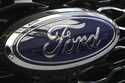 The Ford logo is seen on the grill of a Ford Explorer on display at the Pittsburgh International Au…