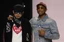 Pharrell Williams, right, walks with with Nigo, artistic designer for Kenzo, with who co-creates a …