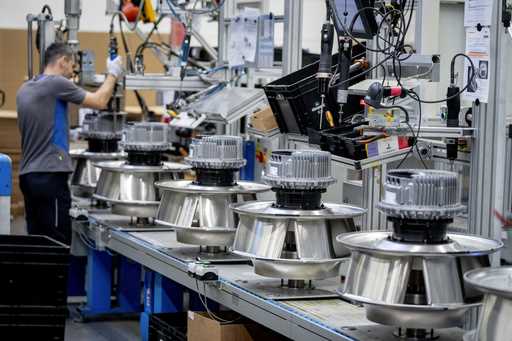 A man works on fans at an EBM-Papst plant in Hollenbach, Germany, Tuesday, February 4, 2025