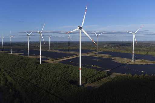 Wind turbines operate at the Klettwitz Nord solar energy park near Klettwitz, Germany, Tuesday, Oct…