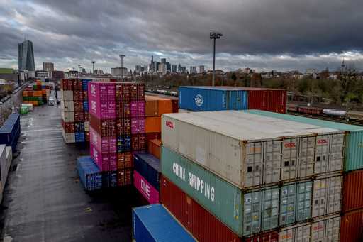 FILE -Containers are stacked at the cargo terminal in Frankfurt, Germany, Friday, December 6, 2024