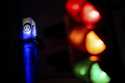 A traffic light shines in front of a Volkswagen logo at the Volkswagen plant in Osnabruck, Germany,…