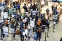 Passengers line up at the security checkpoint in Pittsburgh International Airport December 11, 2024…