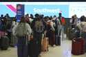 Travelers wait at the check-in counter for Southwest Airlines in Denver International Airport Thurs…