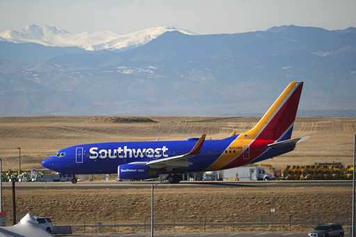 Southwest Airlines jetliner taxis down a runway for take off at Denver International Airport, Tuesd…