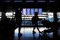 Travelers walk through Terminal 3 at O'Hare International Airport in Chicago, Tuesday, November 26,…