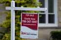 A for sale sign is displayed in front of a home in Wheeling, Ill