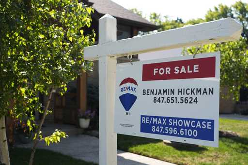 A "For Sale" sign is displayed in front of a home in Morton Grove, Ill