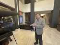 North Carolina Insurance Commissioner Mike Causey, right, speaks to the media before a hearing on h…