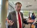 North Carolina Insurance Commissioner Mike Causey talks to reporters at the Albemarle Building in R…