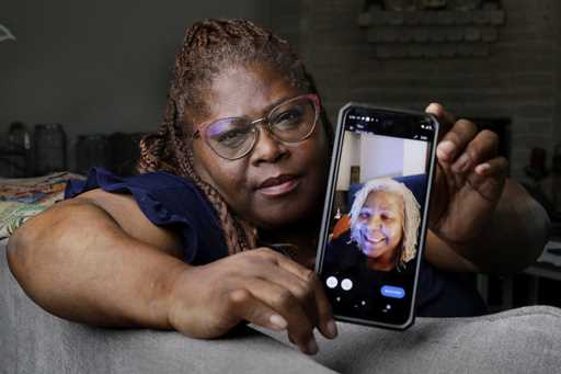 Janet Jarrett shows a photo of her sister, Pamela Jarrett, she keeps on her phone at the home they …