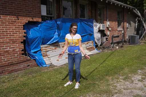 Terra Hillman shows the exterior damage that still exists to her home, caused by Hurricanes Laura a…