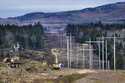 Heavy machinery is used to cut trees to widen an existing Central Maine Power power line corridor t…