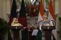 Bangladesh Prime Minister Sheikh Hasina, left, talks to her Indian counterpart Narendra Modi during…