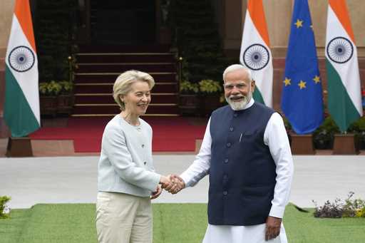 Indian Prime Minister Narendra Modi, right, shakes hands with European Commission President Ursula …