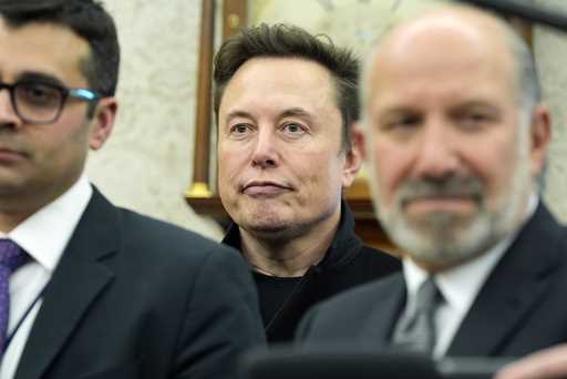 Elon Musk listens as President Donald Trump meets with India's Prime Minister Narendra Modi in the …