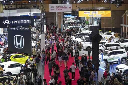 Visitors look at vehicles during the Indonesian International Motor Show in Jakarta, Indonesia, Thu…