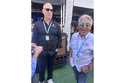 Dan Towriss, the new owner of Andretti Global, laughs with Mario Andretti before the IndyCar Series…