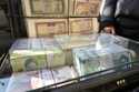 Current and pre-revolution Iranian banknotes are displayed by a street money exchanger at Ferdowsi …