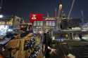 Iraqi security forces stand guard in front of Kentucky Fried Chicken restaurant in Baghdad, Wednesd…