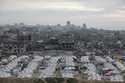 A tent camp for displaced Palestinians is set up amid destroyed buildings in the west of Al-Shati c…