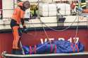 Italian Firefighters scuba divers bring ashore in a green bag the body of one of the victims of the…