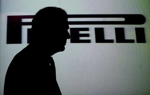 FILE -Pirelli president Marco Tronchetti Provera is silhouetted as he passes in front of the compan…