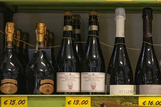 Bottles of Prosecco are lined up on a shelf of a wine shop in Rome, Thursday, February 6, 2025