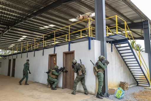 Ivorian special forces soldiers conduct an urban reconnaissance exercise under the supervision of F…