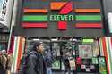 People shop at a 7-Eleven convenience store in New York, Tuesday, March 19, 2024