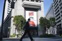 A person walks in front of the Tokyo Stock Exchange building at a securities firm Tuesday, November…