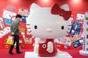 A visitor looks at giant Hello Kitty display at the exhibition 