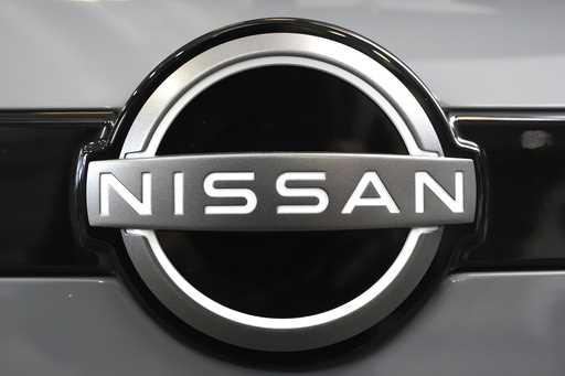 A Nissan logo is displayed on a Nissan Pathfinder SUV at the Pittsburgh International Auto Show in …