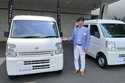 Susumu Miura, a Nissan Research Center manager, shows a Nissan car that is coated with the special …