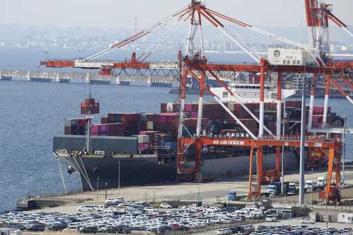 A container ship is loaded and unloaded at a container terminal at a port of Kawasaki near Tokyo on…