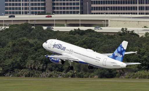 A JetBlue Airways Airbus A320-232 takes off from the Tampa International Airport in Tampa, Fla