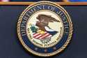 The Department of Justice seals is seen during a news conference at the Department of Justice in Wa…