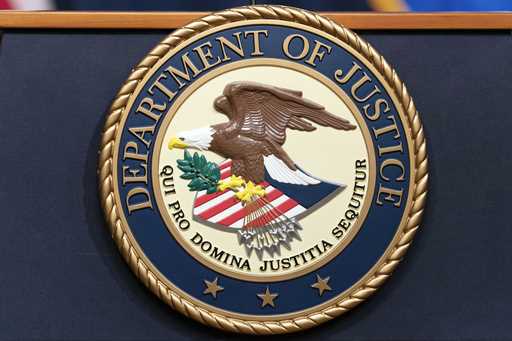 The Department of Justice seals is seen during a news conference at the Department of Justice in Wa…