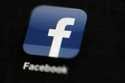 In this May 16, 2012, file photo, the Facebook logo is displayed on a mobile device in Philadelphia…